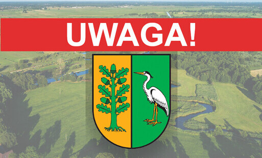 herb gminy z napisem UWAGA